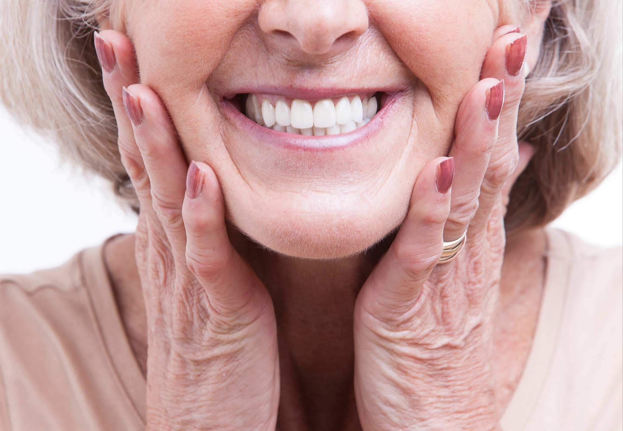 Woman smiling at newly cleaned white teeth