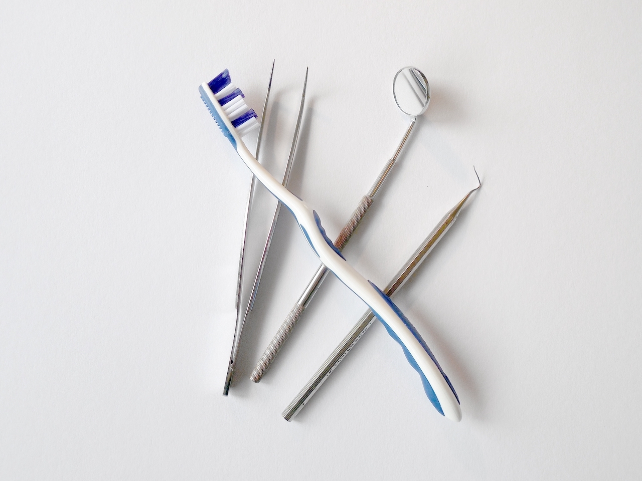 Dentistry tools used to clean teeth: Toothbrush, mirror, scaler
