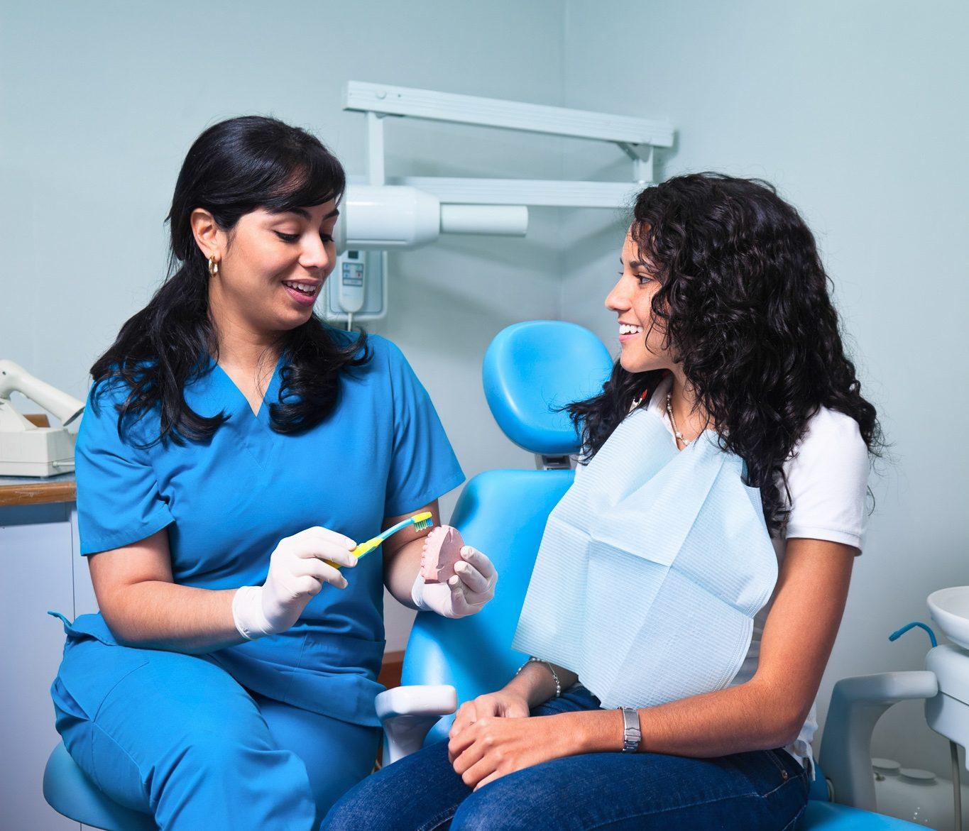 Local dentist consulting with a patient